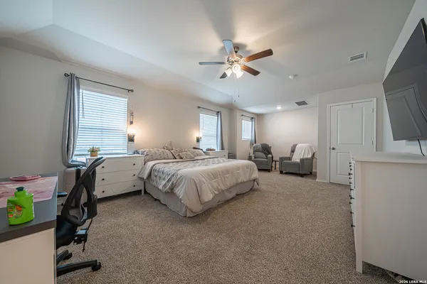 a bedroom with a bed furniture and a window