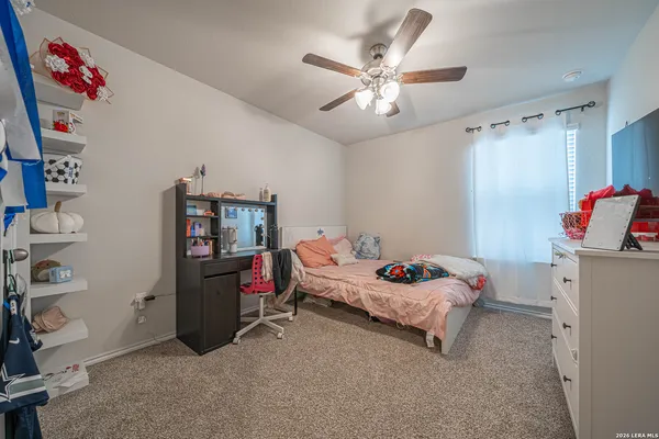 a bedroom with a bed and cabinets