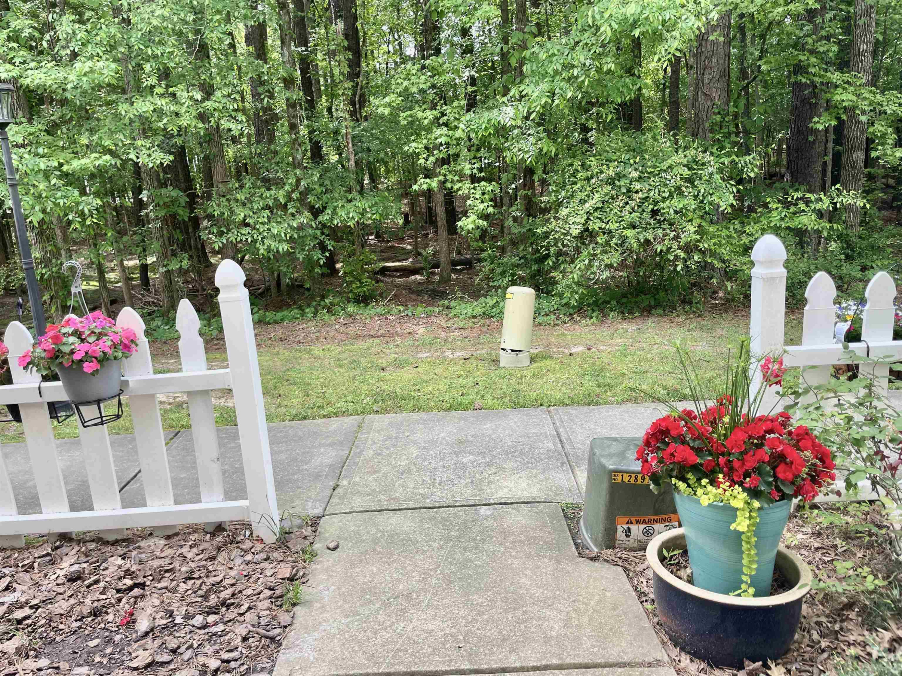 8621 Neuse Club Lane, Unit 109 Raleigh, NC 27616 - Photo 20 of 21 a front view of a house with a yard