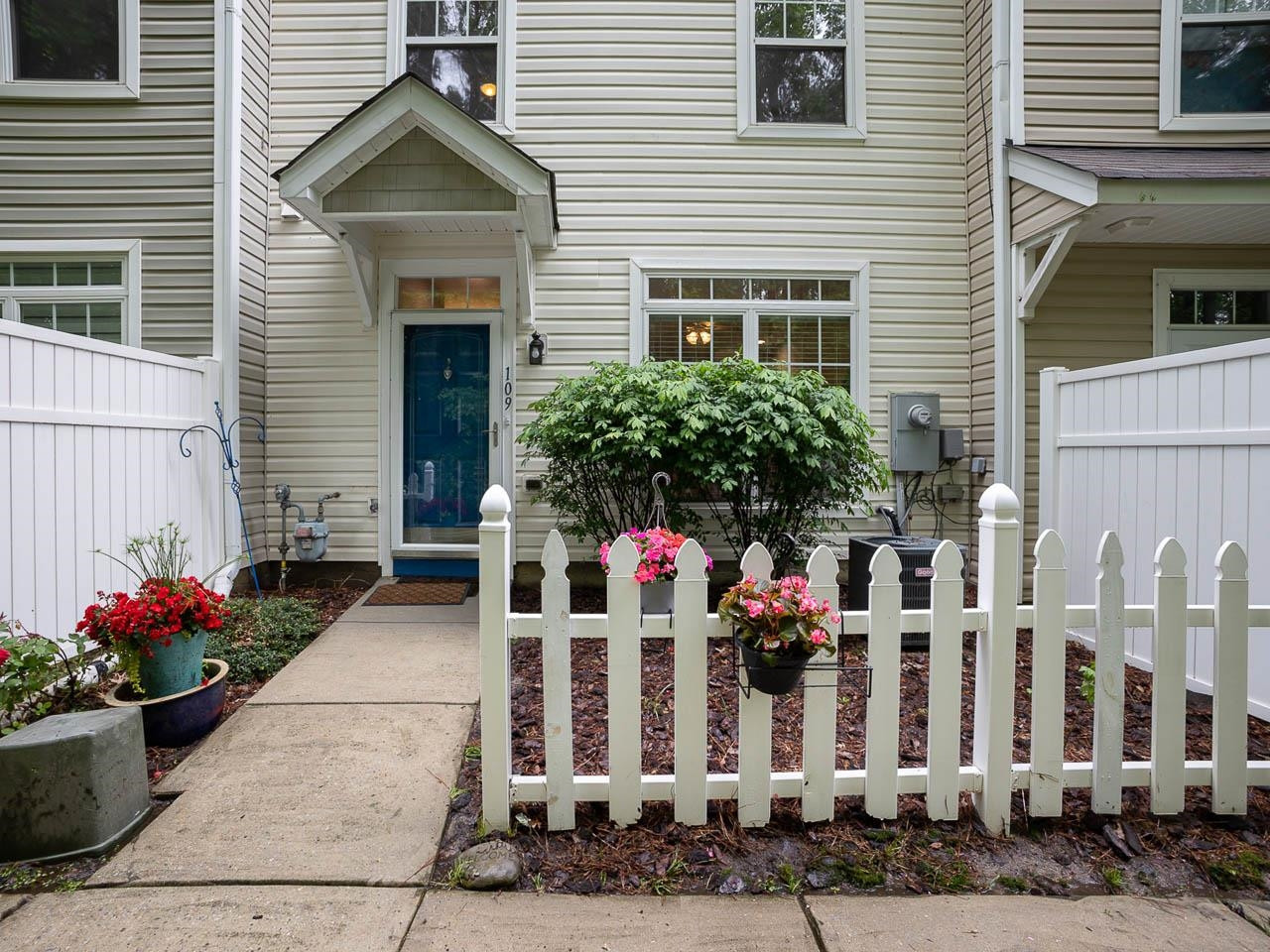 8621 Neuse Club Lane, Unit 109 Raleigh, NC 27616 - Photo 2 of 21 a front view of building with an outdoor space