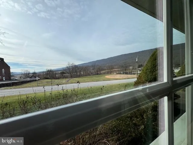 a room with wooden floors and view