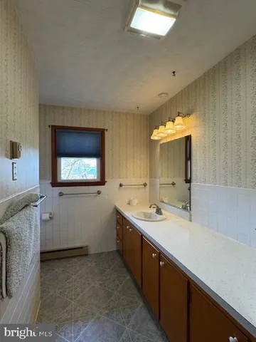 a bathroom with a tub and shower