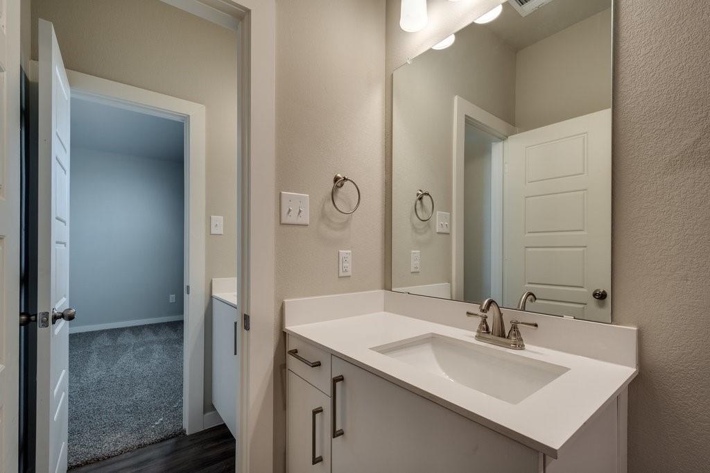 716 Fallow Drive Venus, TX 76084 - Photo 12 of 15 a bathroom with a sink and a mirror
