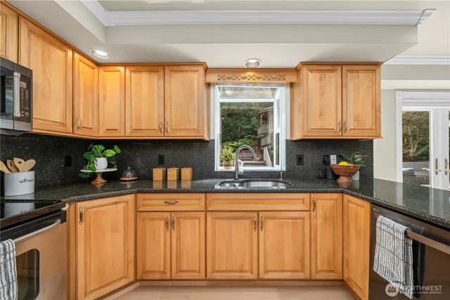 a spacious bedroom with a large bed and a large window