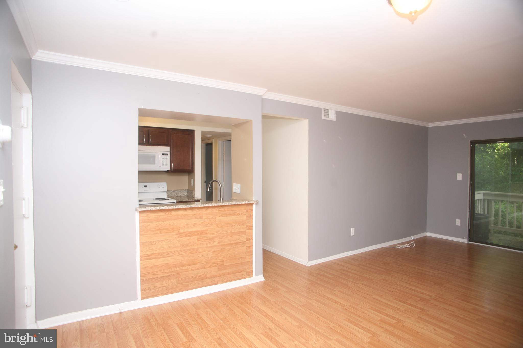 5818 Royal Ridge Drive, Unit Q Springfield, VA 22152 - Photo 3 of 11 View into Kitchen from Living Room