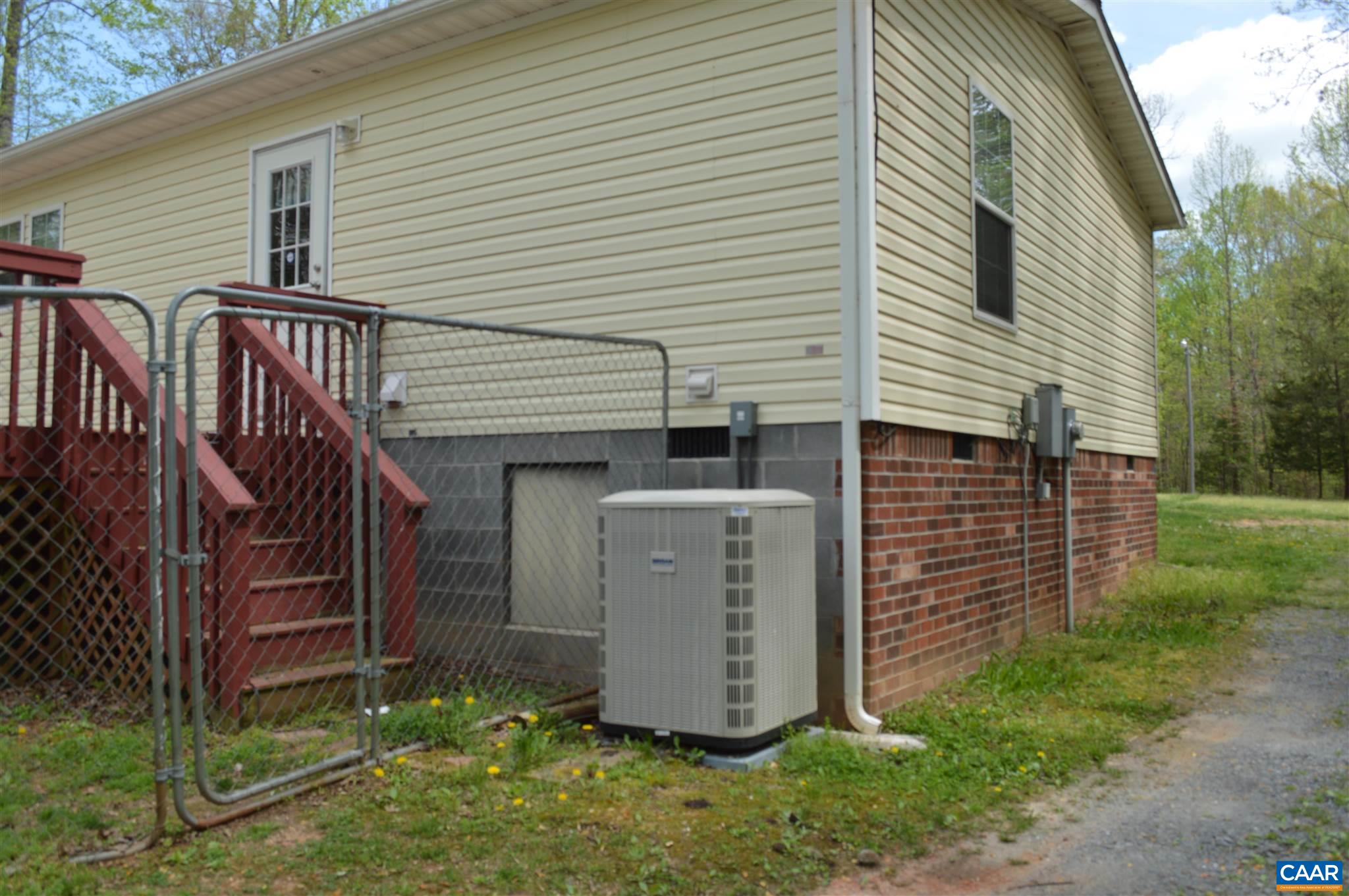 1280 Bell Road Dillwyn, VA 23936 - Photo 2 of 6 a view of a house with a yard and garage