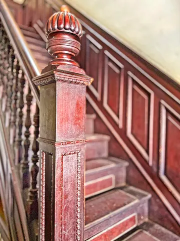 a view of a balcony with wooden floor