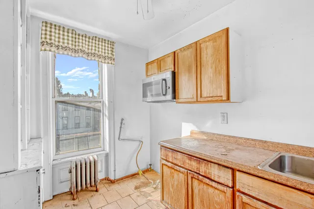 a picture of outdoor space with a window and couch