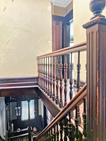 a bedroom with furniture and a flat screen tv