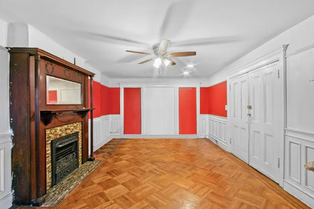 a living room with furniture a rug and a window