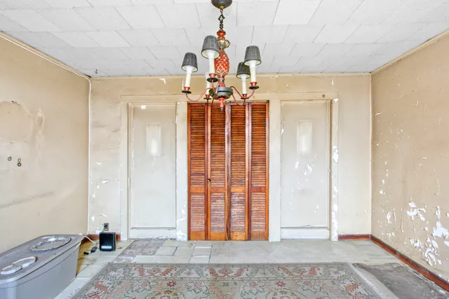 a backyard of a house with a table and chair