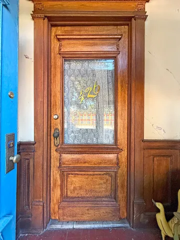 a picture of a bench in front of a door