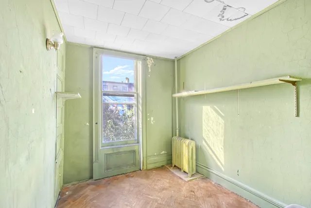 a view of an empty room and window