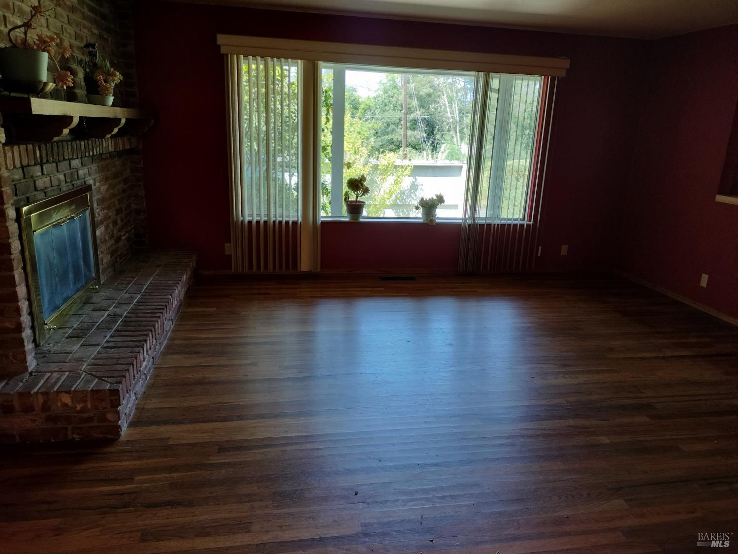 7149 Lynch Road Sebastopol, CA 95472 - Photo 18 of 25 a view of an empty room with wooden floor and a window