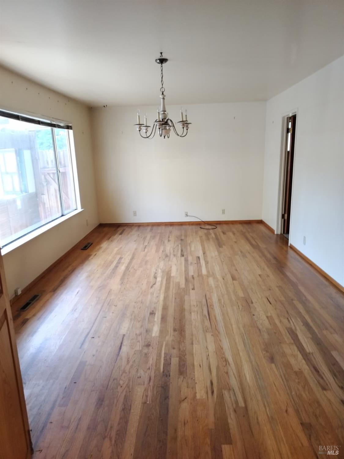 7149 Lynch Road Sebastopol, CA 95472 - Photo 10 of 25 wooden floor in an empty room with a window