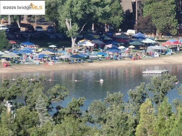 a view of water pond with outdoor seating