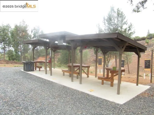 a view of swimming pool with lawn chairs