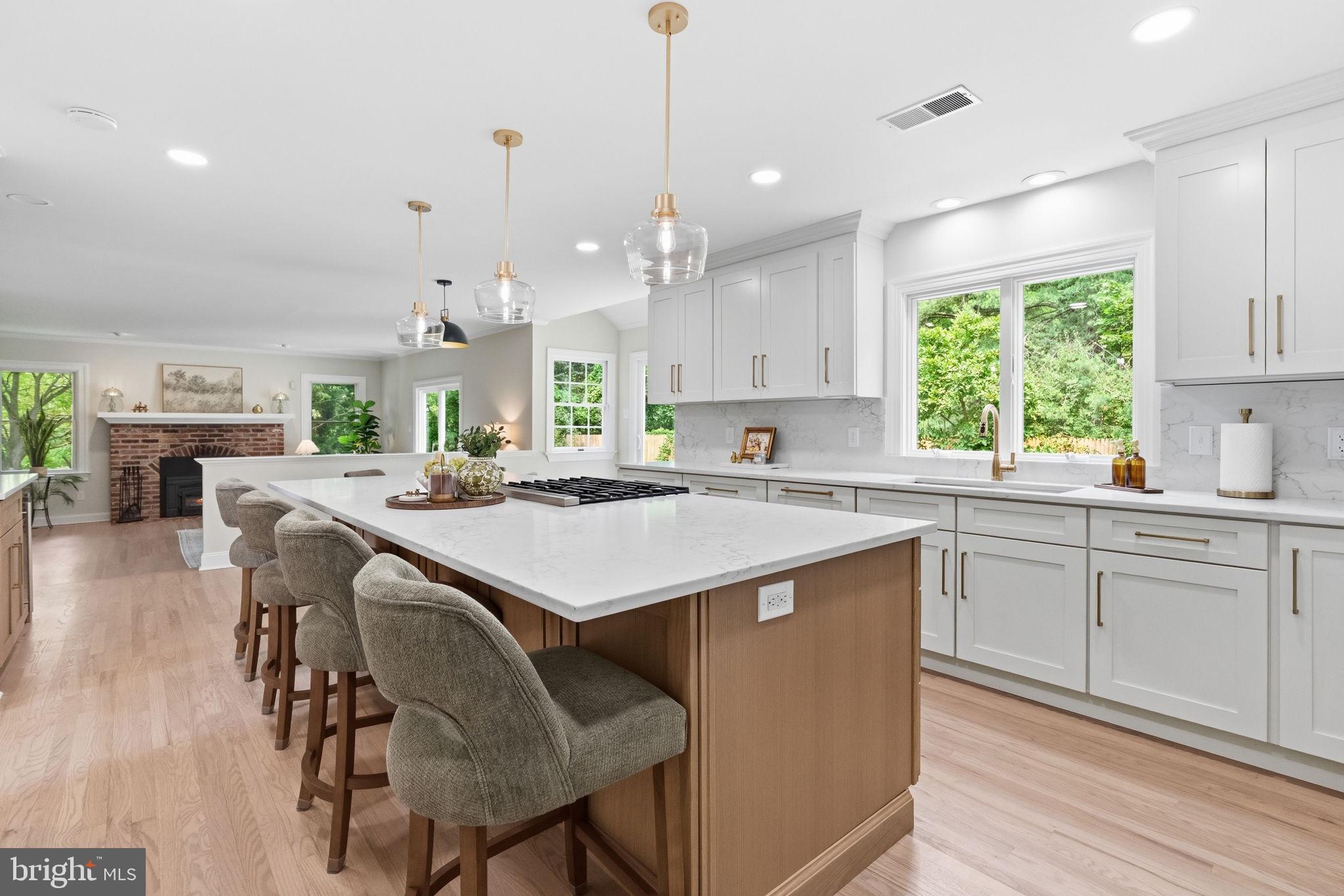2971 Comfort Road New Hope, PA 18938 - Photo 16 of 60 a kitchen with kitchen island a dining table chairs sink and cabinets