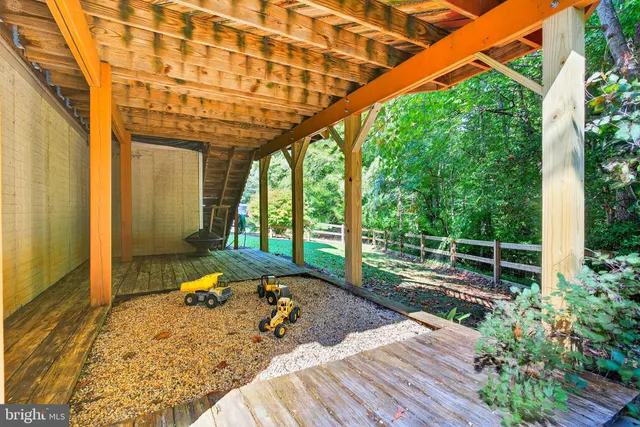 a house that has a tree in front of it