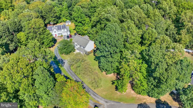 a house with trees in the background