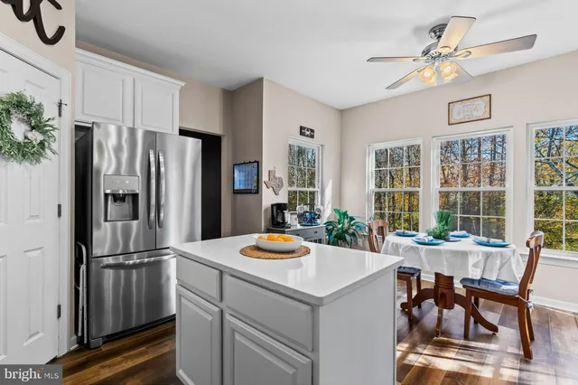 a kitchen with a dining table and chairs