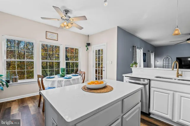 a living room with kitchen island furniture and a table