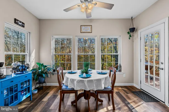 a view of a dining room with furniture window and wooden floor