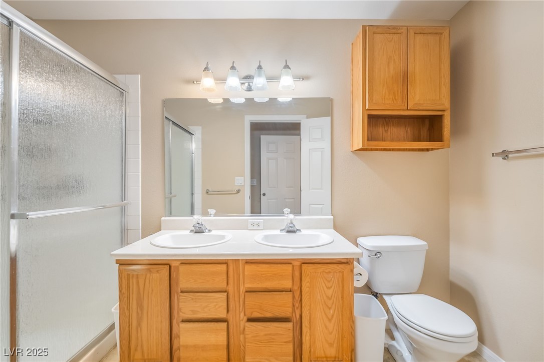 1509 Dallas Terrace, Unit 294 Henderson, NV 89014 - Photo 13 of 27 Full bath featuring double vanity and a stall shower