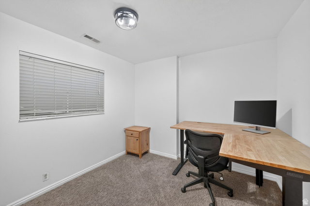 788 East Gables Street Midvale, UT 84047 - Photo 15 of 24 Carpeted basement bedroom 2 with white walls, featuring a window with horizontal blinds