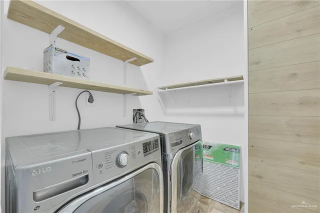 a utility room with dryer and washer