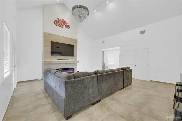 a living room with furniture and a flat screen tv