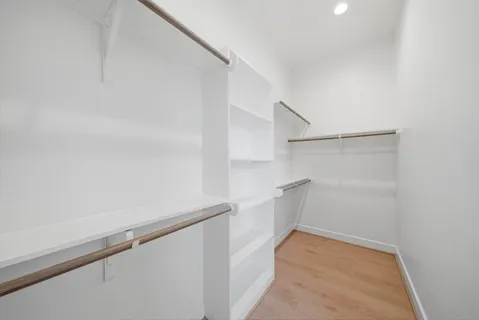 a view of an empty walk in closet