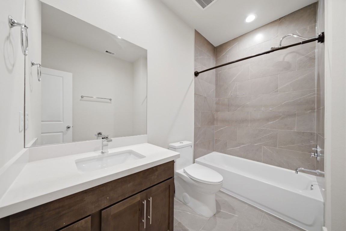 5906 Jasper Jones Way Houston, TX 77091 - Photo 17 of 22 a bathroom with a sink a toilet and shower