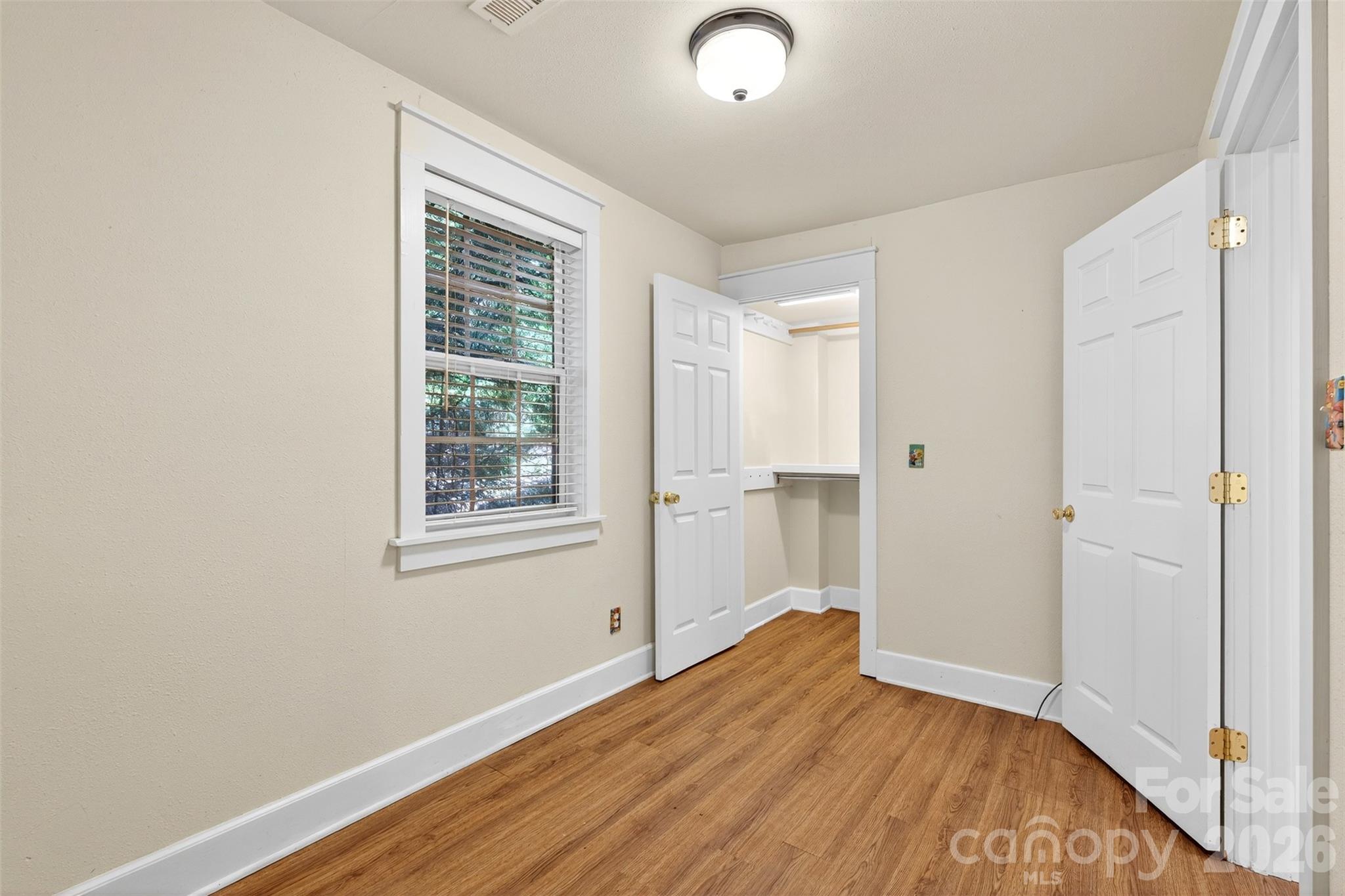 160 East Howard Street Tryon, NC 28782 - Photo 30 of 48 a view of empty room with wooden floor and fan