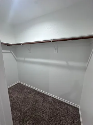 an empty room with a washer and dryer