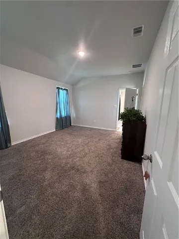 a bathroom with a granite countertop sink a mirror and shower