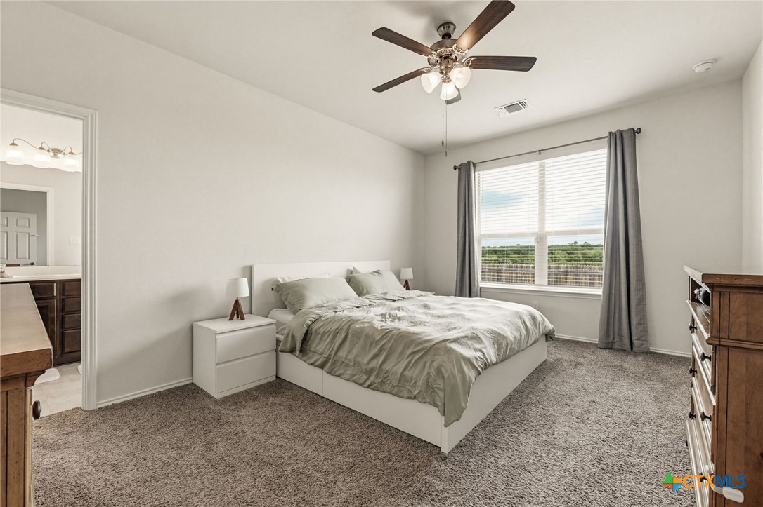 2044 Mallard Court Copperas Cove, TX 76522 - Photo 13 of 41 a bed room with a bed and a ceiling fan