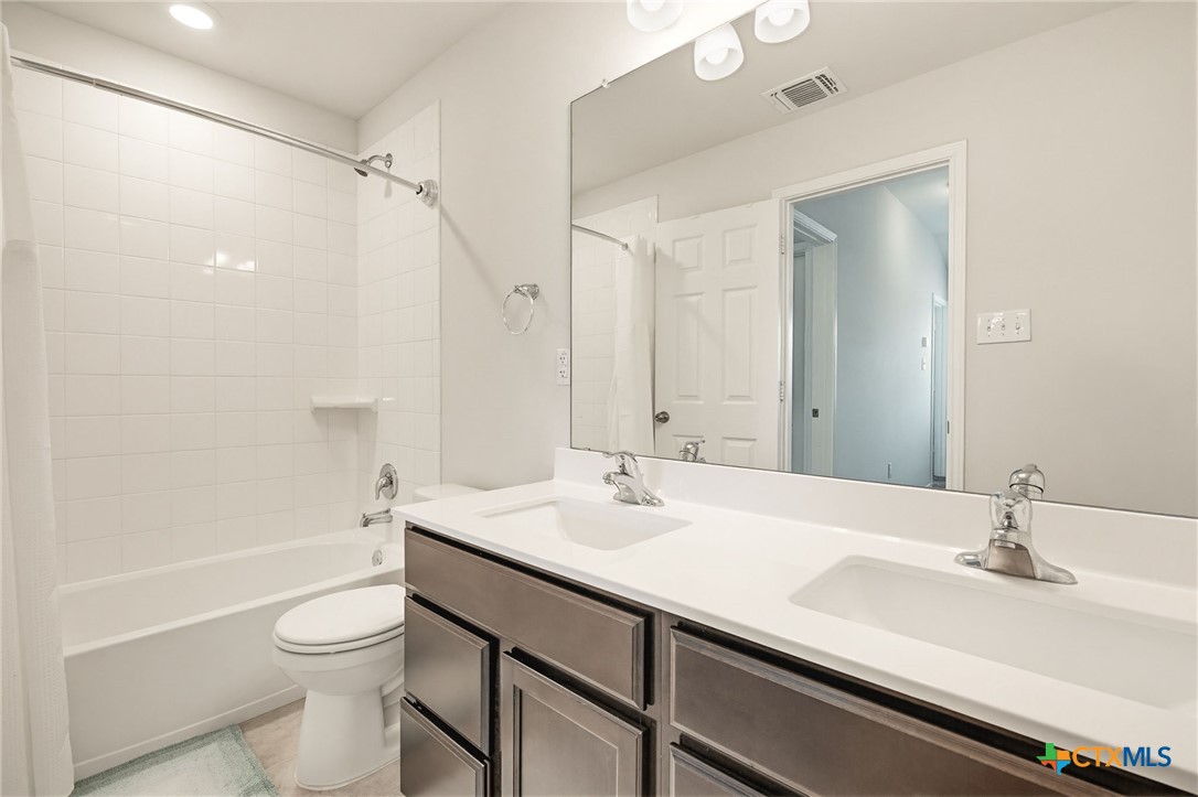 2044 Mallard Court Copperas Cove, TX 76522 - Photo 23 of 41 a bathroom with a sink a toilet and shower