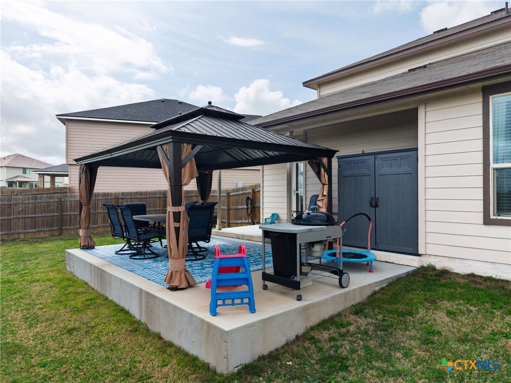 2044 Mallard Court Copperas Cove, TX 76522 - Photo 27 of 41 a view of a patio with table and chairs potted plants and floor to ceiling window