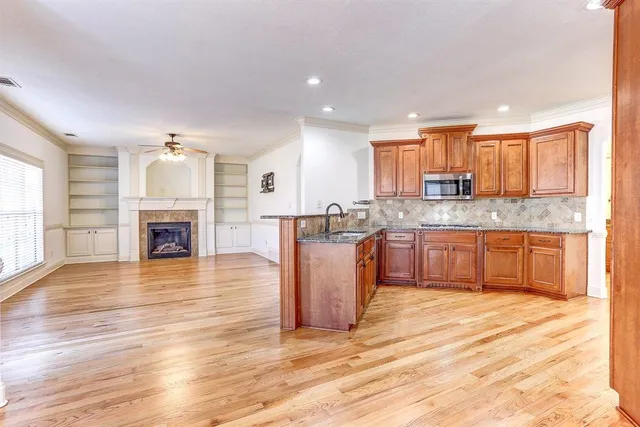 an aerial view of a house with swimming pool garden and patio
