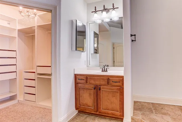 a bathroom with a tub a window and a shower