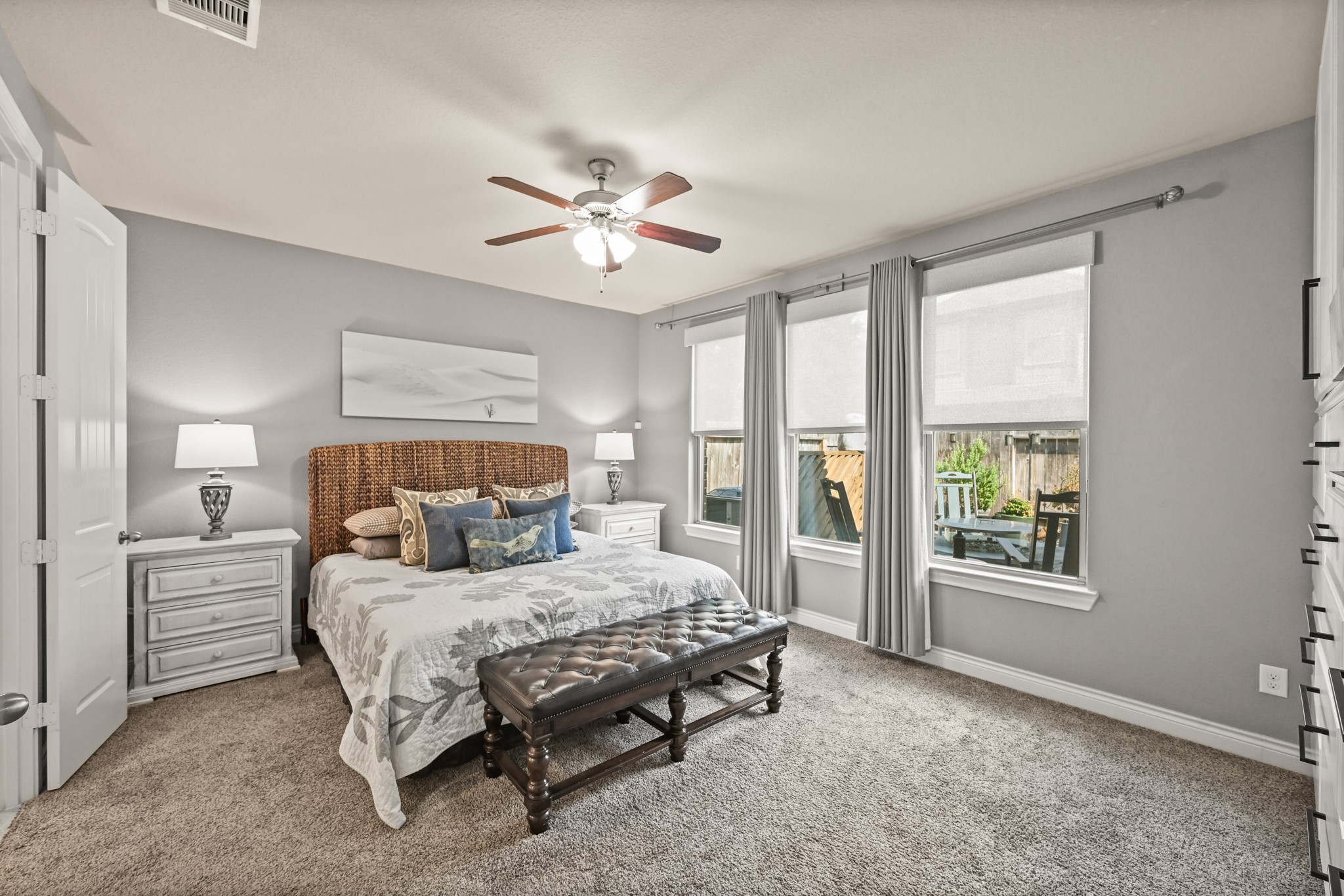 24214 Calico Trace Lane Katy, TX 77494 - Photo 17 of 49 a bedroom with a large bed and a chandelier