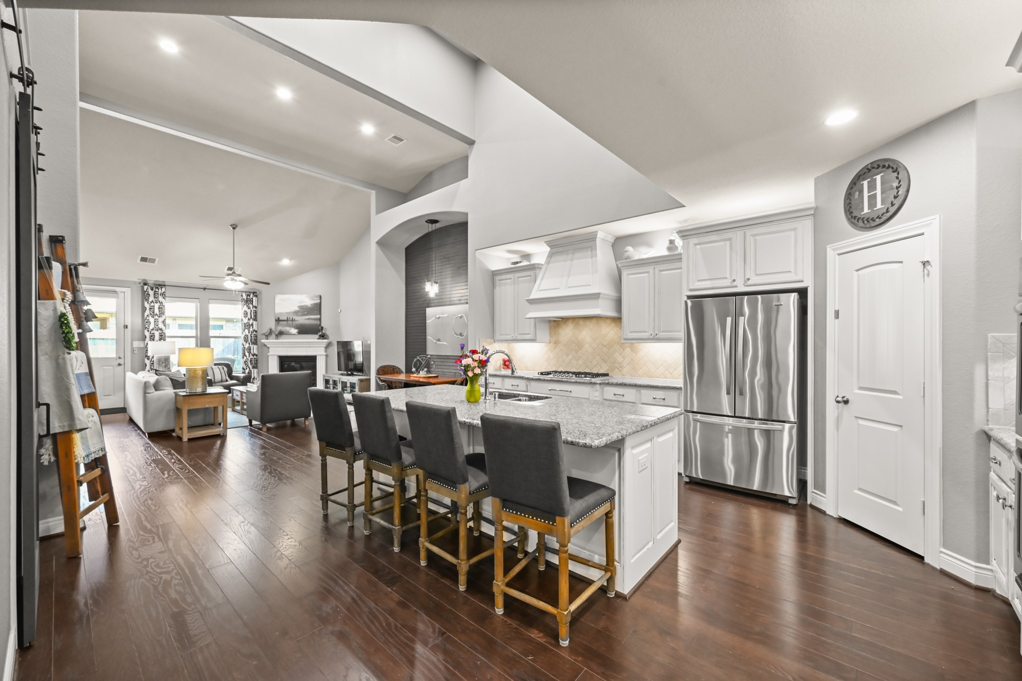 24214 Calico Trace Lane Katy, TX 77494 - Photo 20 of 49 a kitchen with stainless steel appliances granite countertop a table chairs and a refrigerator