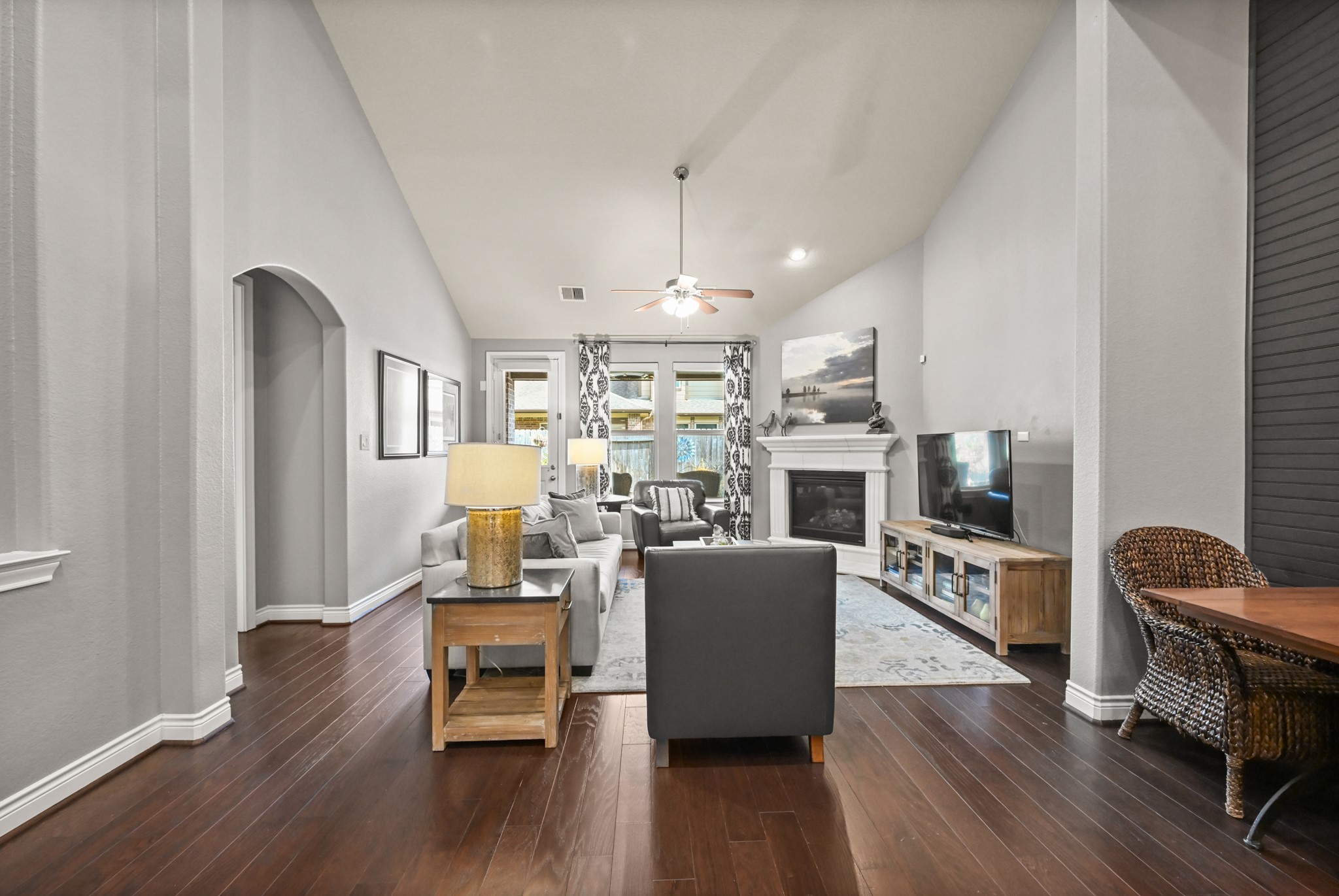 24214 Calico Trace Lane Katy, TX 77494 - Photo 25 of 49 a living room with furniture a fireplace and a wooden floor