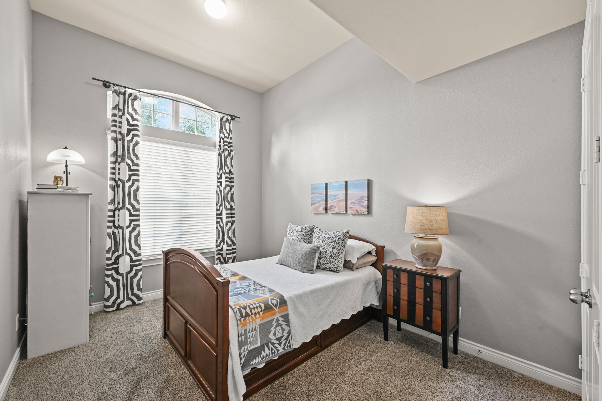 24214 Calico Trace Lane Katy, TX 77494 - Photo 28 of 49 a bedroom with a bed and a lamp