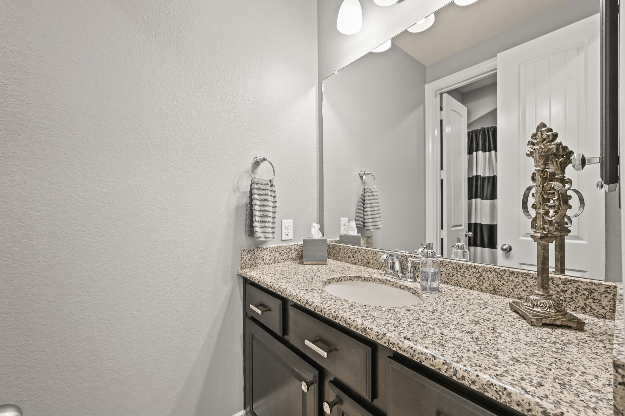 24214 Calico Trace Lane Katy, TX 77494 - Photo 29 of 49 a bathroom with a granite countertop sink and a mirror