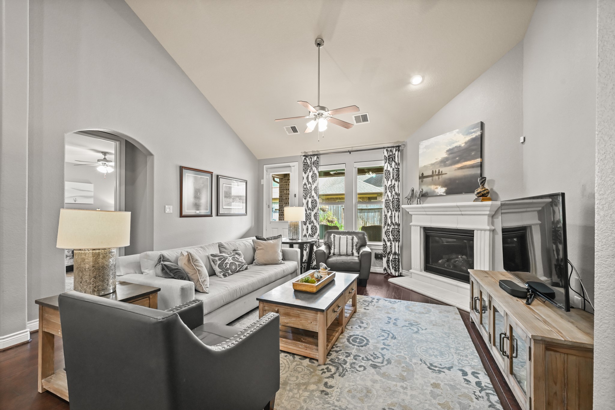 24214 Calico Trace Lane Katy, TX 77494 - Photo 4 of 49 a living room with furniture a fireplace and a flat screen tv