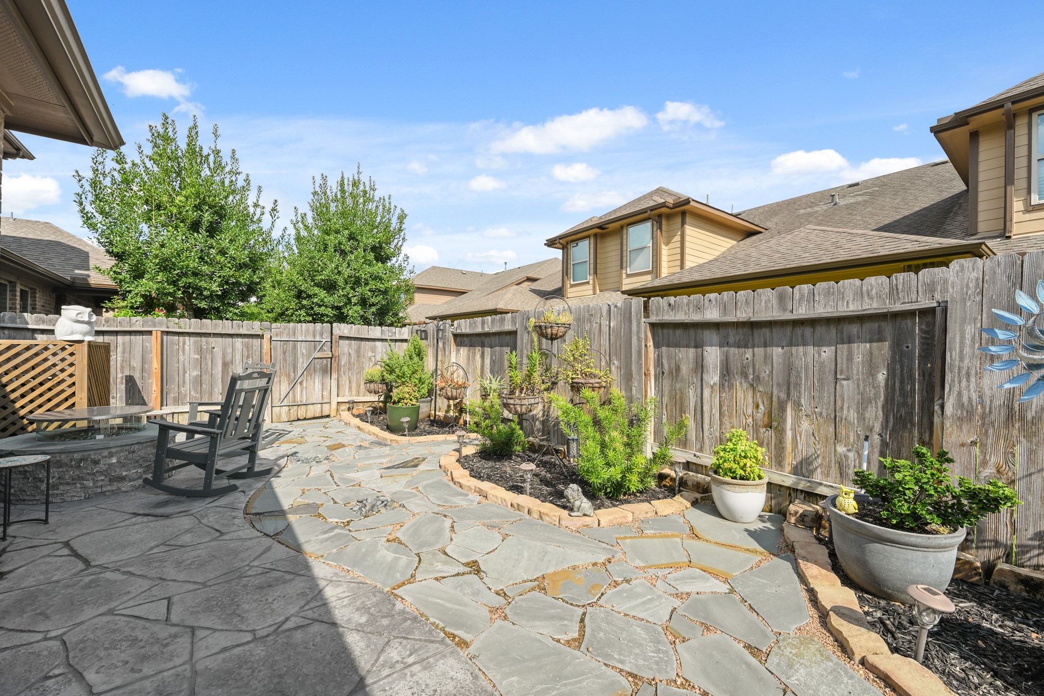 24214 Calico Trace Lane Katy, TX 77494 - Photo 42 of 49 a view of a chair and table in backyard of the house