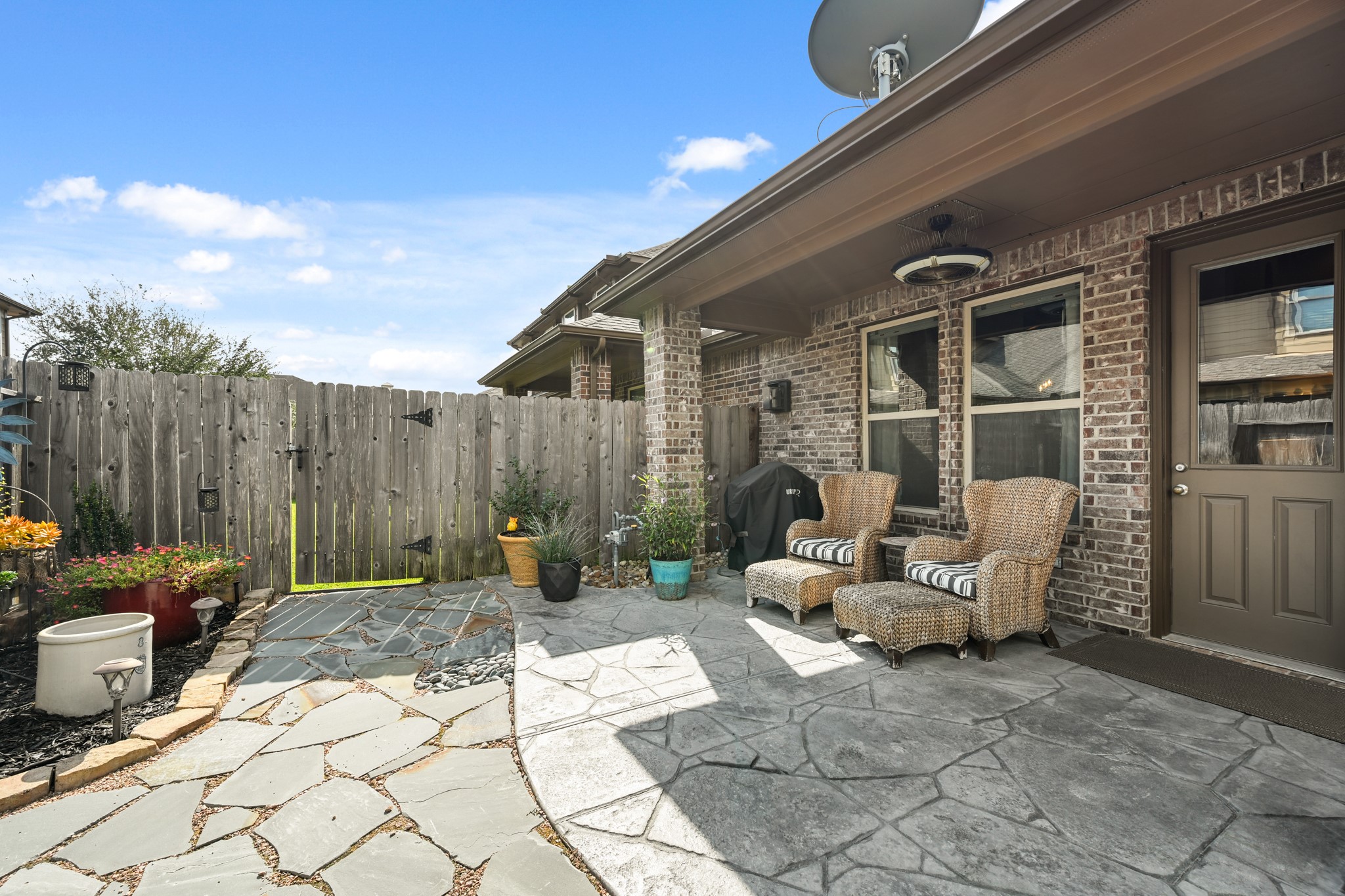 24214 Calico Trace Lane Katy, TX 77494 - Photo 45 of 49 a backyard of a house with sofas fire pit and furniture