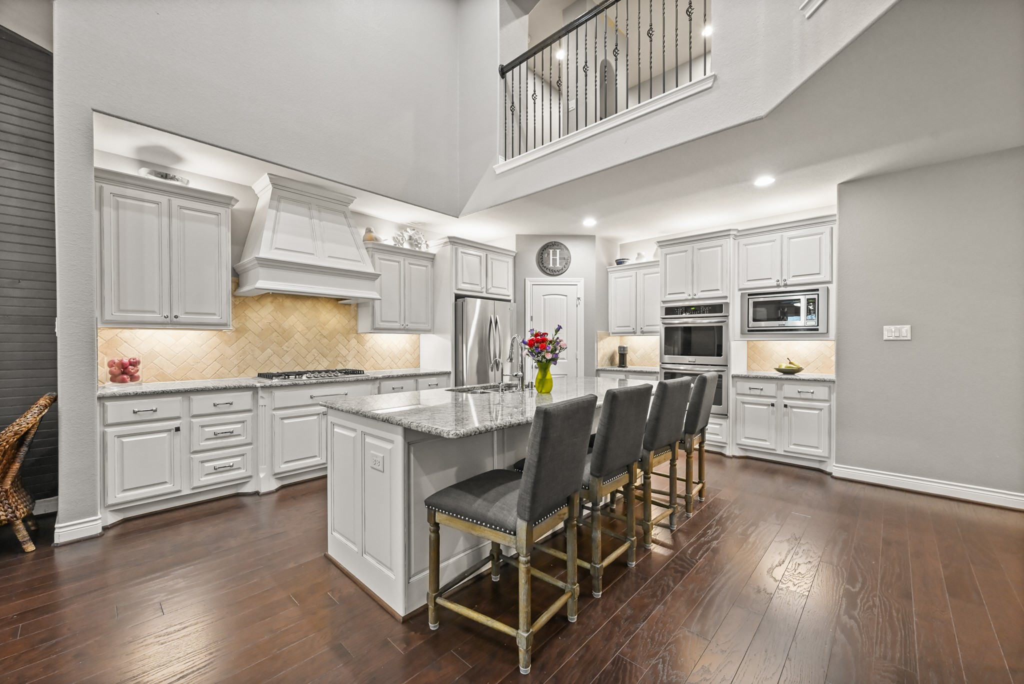 24214 Calico Trace Lane Katy, TX 77494 - Photo 6 of 49 a kitchen with stainless steel appliances granite countertop a kitchen island hardwood floor and a sink